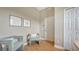 Light and airy hallway with wood floors, stylish seating, and modern decor at 13625 3Rd Ne Ave, Bradenton, FL 34212