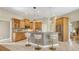 Well-lit kitchen featuring a breakfast bar with stylish seating and modern appliances at 13625 3Rd Ne Ave, Bradenton, FL 34212