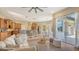Open living area with breakfast bar, dining area, and view to the pool and screened lanai at 13625 3Rd Ne Ave, Bradenton, FL 34212