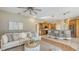 Open living space with a modern kitchen, comfortable seating, and a neutral color palette at 13625 3Rd Ne Ave, Bradenton, FL 34212