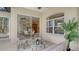 Comfortable seating area with a ceiling fan to add to the covered patio and indoor/outdoor living experience at 13625 3Rd Ne Ave, Bradenton, FL 34212
