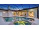 Covered outdoor pool and spa area, perfect for relaxation and entertaining at 13625 3Rd Ne Ave, Bradenton, FL 34212
