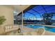 Relaxing screened-in pool area offers a private oasis with a hot tub and spacious seating area at 13625 3Rd Ne Ave, Bradenton, FL 34212