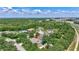 Picture of a property featuring a private pool in a green, tree-filled neighborhood, with community amenities visible in the surroundings at 14104 E 22Nd Ter, Bradenton, FL 34212