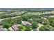 An aerial view of the home with screened-in pool and nearby community amenities at 14104 E 22Nd Ter, Bradenton, FL 34212