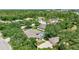 Aerial view of a neighborhood featuring luxurious homes, lush landscaping, and mature trees at 14104 E 22Nd Ter, Bradenton, FL 34212