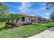 Serene backyard featuring lush landscaping and a screened-in patio for relaxed outdoor living at 14104 E 22Nd Ter, Bradenton, FL 34212