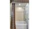 Clean bathroom featuring a shower and tub with a stylish shower curtain at 14104 E 22Nd Ter, Bradenton, FL 34212
