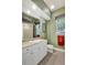 Bathroom featuring a vanity, toilet, mirror, and window at 14104 E 22Nd Ter, Bradenton, FL 34212