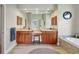 Bright bathroom featuring double vanities, a soaking tub, granite countertops, and ample storage space at 14104 E 22Nd Ter, Bradenton, FL 34212
