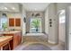 Well-appointed bathroom features a large soaking tub, a separate shower, and a granite-topped vanity at 14104 E 22Nd Ter, Bradenton, FL 34212