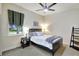Charming bedroom featuring a cozy bed, stylish window treatments, and a ceiling fan at 14104 E 22Nd Ter, Bradenton, FL 34212