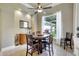 Cozy dining area with modern decor, tile floors, and a view of the landscaped outdoors at 14104 E 22Nd Ter, Bradenton, FL 34212