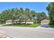 The exterior view of a home and a garage, beautiful landscaping, and an extra long driveway at 14104 E 22Nd Ter, Bradenton, FL 34212