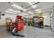 Spacious, well-lit garage featuring ample shelving, a tool chest, and overhead storage for organization at 14104 E 22Nd Ter, Bradenton, FL 34212