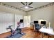 Home office with an exercise bike, wood floors, two closets and space for dual workstations at 14104 E 22Nd Ter, Bradenton, FL 34212
