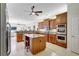 Gourmet kitchen featuring wooden cabinetry, granite countertops, and stainless steel appliances at 14104 E 22Nd Ter, Bradenton, FL 34212