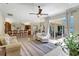 Bright living room with tile flooring and large sliding glass doors that lead to an outdoor living area at 14104 E 22Nd Ter, Bradenton, FL 34212
