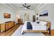 Primary bedroom showcasing tray ceilings, wood floors, generous natural light, and soothing color palette at 14104 E 22Nd Ter, Bradenton, FL 34212