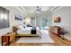 Spacious bedroom featuring wood floors, a ceiling fan, and access to the pool area at 14104 E 22Nd Ter, Bradenton, FL 34212