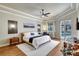 Bedroom with a king bed, wood floors, a ceiling fan, and access to the pool at 14104 E 22Nd Ter, Bradenton, FL 34212