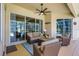 Inviting covered patio with comfortable seating overlooking a pool at 14104 E 22Nd Ter, Bradenton, FL 34212