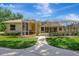 Beautiful home featuring a screened lanai, lush green lawn, and walkway at 14104 E 22Nd Ter, Bradenton, FL 34212
