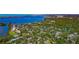 Wide aerial shot showcasing a community nestled among lush trees and winding waterways at 1532 Pelican Point Dr # 240, Sarasota, FL 34231