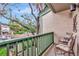 Private balcony furnished with chairs offers a relaxing outdoor space with neighborhood views at 1532 Pelican Point Dr # 240, Sarasota, FL 34231