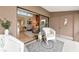 Relaxing covered balcony with seating with sliding glass doors to living area at 1532 Pelican Point Dr # 240, Sarasota, FL 34231
