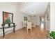 Dining area with stylish glass table and chairs, adjacent to the living area at 1532 Pelican Point Dr # 240, Sarasota, FL 34231