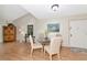 Bright dining area with vaulted ceiling and modern light fixture at 1532 Pelican Point Dr # 240, Sarasota, FL 34231