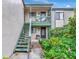 Charming condo entrance with private staircase and well-maintained landscaping at 1532 Pelican Point Dr # 240, Sarasota, FL 34231