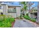 Charming condo building with lush landscaping, private balconies, and a dedicated parking spot at 1532 Pelican Point Dr # 240, Sarasota, FL 34231