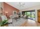 Bright living room featuring vaulted ceiling, natural light, and access to screened lanai at 1532 Pelican Point Dr # 240, Sarasota, FL 34231