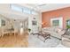 Open-concept living room with dining area and sliding doors to the screened lanai at 1532 Pelican Point Dr # 240, Sarasota, FL 34231