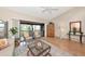 Cozy living room with screened lanai access, offering natural light and a relaxing atmosphere at 1532 Pelican Point Dr # 240, Sarasota, FL 34231