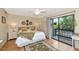 Comfortable bedroom with hardwood floors, neutral decor, and ample natural light at 1532 Pelican Point Dr # 240, Sarasota, FL 34231