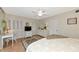 Comfortable bedroom with hardwood floors, neutral decor, and ample natural light at 1532 Pelican Point Dr # 240, Sarasota, FL 34231