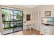 Comfortable bedroom with hardwood floors, neutral decor, and ample natural light at 1532 Pelican Point Dr # 240, Sarasota, FL 34231