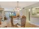 Bright dining room with a view of the living room and kitchen at 1532 Pelican Point Dr # Ba139, Sarasota, FL 34231