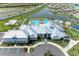Aerial view of community center, pool, playground, and lake at 15503 Sunny Day Dr, Bradenton, FL 34211