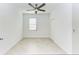 Bedroom featuring tiled floors, ceiling fan, and window at 15503 Sunny Day Dr, Bradenton, FL 34211