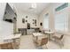 Inviting coffee bar area with tables, chairs, mounted TV, and beverage station at 15503 Sunny Day Dr, Bradenton, FL 34211