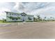 Exterior of community center with ample parking and lush landscaping at 15503 Sunny Day Dr, Bradenton, FL 34211