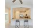 Bright kitchen featuring a breakfast bar with seating and modern appliances at 15503 Sunny Day Dr, Bradenton, FL 34211