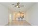 Open floor plan with tiled floors and view of the kitchen's breakfast bar at 15503 Sunny Day Dr, Bradenton, FL 34211