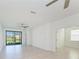 Bright living room with tiled floors and sliding glass doors to the outside at 15503 Sunny Day Dr, Bradenton, FL 34211