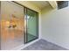 Covered patio with sliding glass doors leading to a bright living space at 15503 Sunny Day Dr, Bradenton, FL 34211