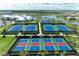 Community tennis and basketball courts near the clubhouse and pool with manicured landscaping at 15503 Sunny Day Dr, Bradenton, FL 34211